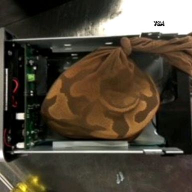 VIDEO: Airport security agents at Miami International Airport stopped a woman from boarding a plane with a python wrapped in a nylon stocking concealed in a computer hard drive Sunday.