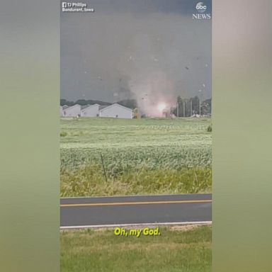 A tornado rips the roof off several homes near Des Moines, Iowa as severe thunderstorms moved across the state.