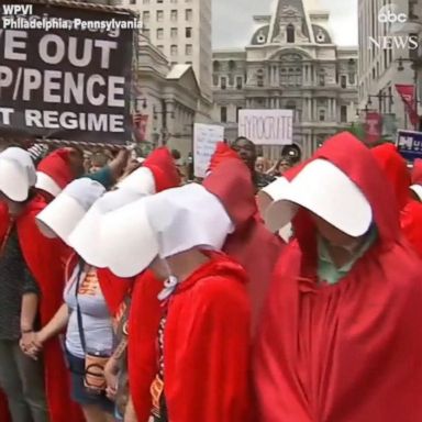 VIDEO: Protesters use "The Handmaid's Tale" to troll VP Pence