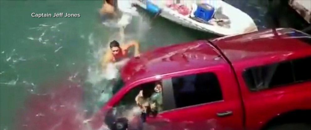 Bystanders jump into water in California to help rescue 2 people and a dog from sinking car - ABC News