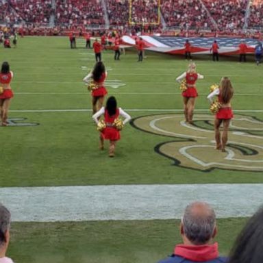 VIDEO: A San Francisco 49ers cheerleader dropped to her knee during the national anthem ahead of Thursday's matchup against the Oakland Raiders.