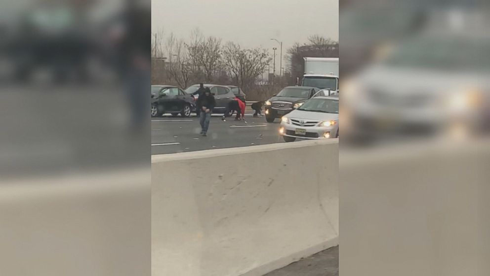 VIDEO: People got out of their cars and were grabbing the cash that dropped out of an armored truck.