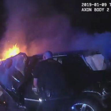 Bodycam captures officers saving man from burning car | GMA