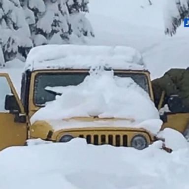 VIDEO: After five days of drinking melted snow, bundled up in a Jeep buried in feet of snow, Maia Herman-Kitami and Carlos Hernandez couldn't have been happier to see a group of strangers on snowmobiles.