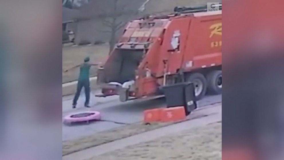 VIDEO: This trash collector was captured on video jumping on a trampoline left by the side of the road for trash pickup.