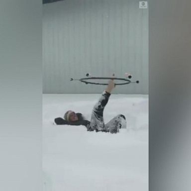 VIDEO: Two performers found one way to warm up in the middle of snowy Oregon, with some impressive fire dancing skills.