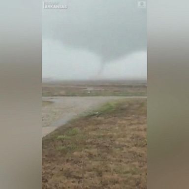 VIDEO: A reported tornado twists just outside a town in Arkansas, as a severe storm moves East bringing damaging winds and large hail. 