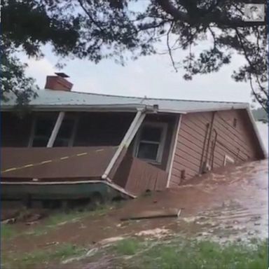 Erosion caused by flooding left several homes on the verge of falling into Oklahoma's swollen Cimarron River, including at least one that was swept away in the rushing waters.