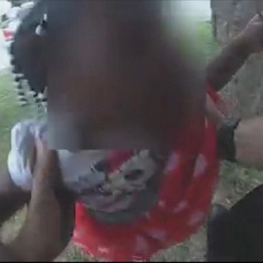 Police in Missouri are seen in bodycam video rushing in to pull a 3-year-old and her grandmother out of a basement window as the house burned above.