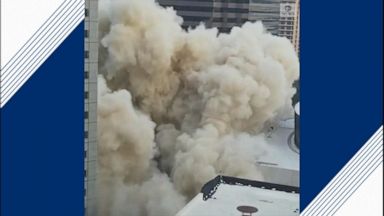 People gathered to watch a spectacular controlled implosion of an office building in Dallas, Texas Saturday.