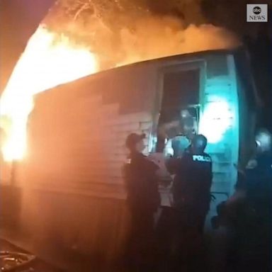 VIDEO: Police scramble to rescue person from flaming trailer in Georgia