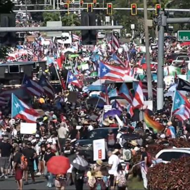 Tens of thousands of protesters Monday morning showed their outrage by shutting down a major freeway in the U.S. territory's capital.