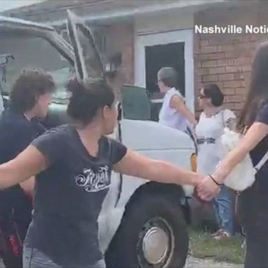 Some hand holding by residents in Hermitage, Tennessee, allowed one man and his son to get home.