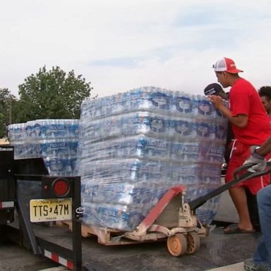 The city's effort to distribute bottled water was put on hold after an initial shipment was found to be past its "best by" date.