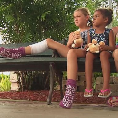 The girl was wading in about knee-deep water at New Smyrna Beach in Florida when she felt a bite to her right leg.