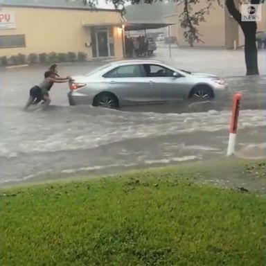 VIDEO: Women help driver stuck in floodwater in Houston