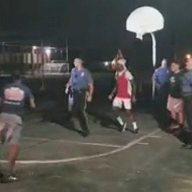 A group of teens playing nighttime basketball in New Jersey got more than they bargained for when a squad car pulled up Monday night.