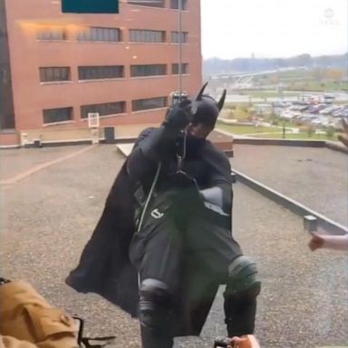 VIDEO: Superhero police officers surprise children's hospital patients