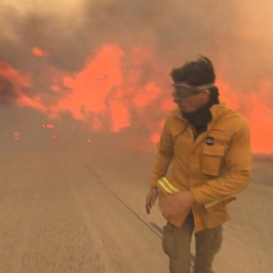 Tall flames approached roads as emergency planes dumped retardant from above. 