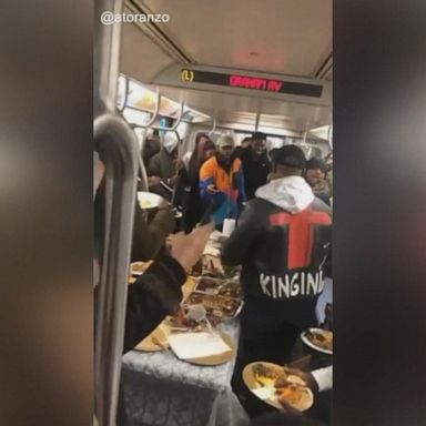 Passengers onboard the L train from Manhattan to Brooklyn were surprised with plates of mashed potatoes, mac 'n cheese, turkey and more. 