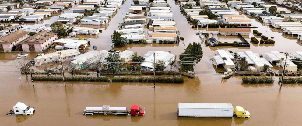PHOTO: Trucks and homes are partially submerged in a flooded neighborhood in Merced, Calif. on Jan. 10, 2023.