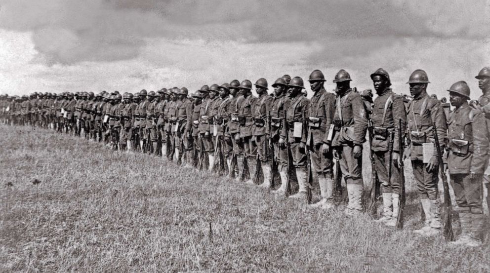 PHOTO: African American soldiers of the 369th Infantry Regiment known as "Harlem Hellfighters," line up in France during World War I, ca. 1918.
