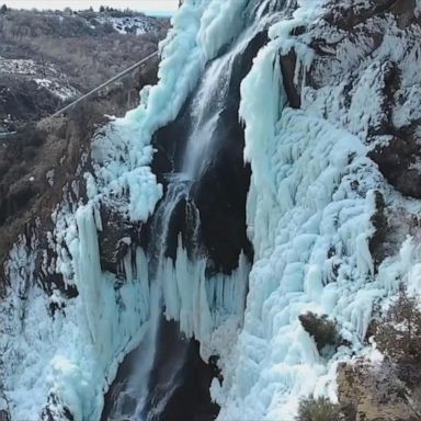 Local drone pilot captured the peaceful scene over a frozen waterfall at Ogden Canyon in Utah.