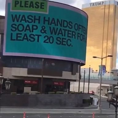 As Las Vegas businesses shut down to reduce the coronavirus spread, a billboard on the empty strip is promoting public health advice: “wash hands often."