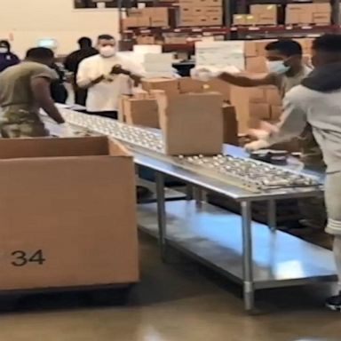 National Guard forms assembly line at food bank