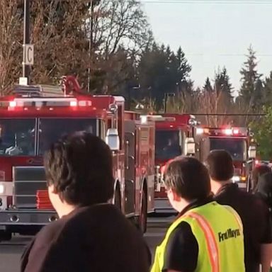 VIDEO: Fire department honors grocery store workers with drive-by parade