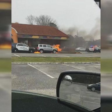 VIDEO: Police SUV pushes burning vehicle away from Taco Bell drive-thru