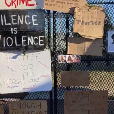 Security fence covered with signs near White House