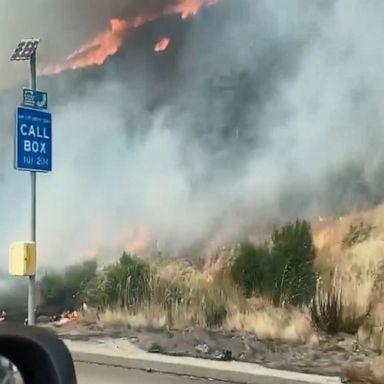 Wildfire jumps highway in California