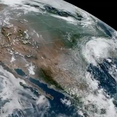 The GOES-West satellite captured wildfire smoke on the West Coast and hurricane clouds over the Gulf of Mexico.