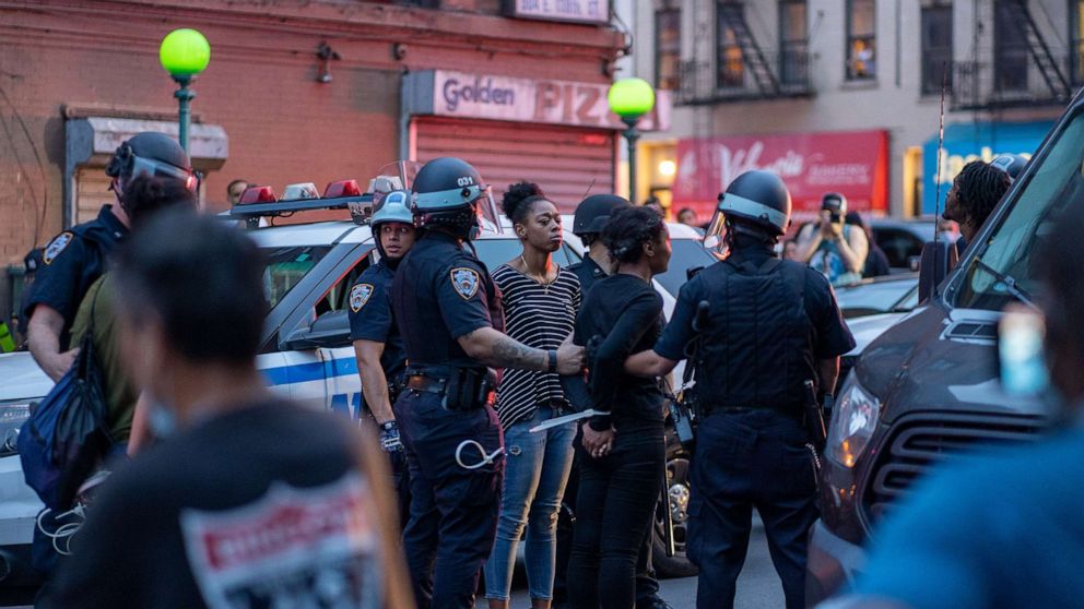 PHOTO: NYPD arrest protesters for breaking the citywide 8:00PM curfew on June 4, 2020 in the Bronx borough of New York City.