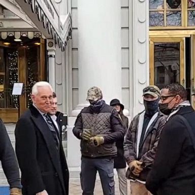 Video surfaces showing longtime Trump confidant Roger Stone flanked by Oath Keepers militia members hours before deadly U.S. Capitol siege.
