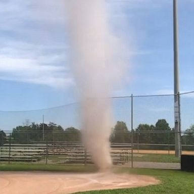 A small dust devil appeared on a softball field at a high school in Alabama during practice.