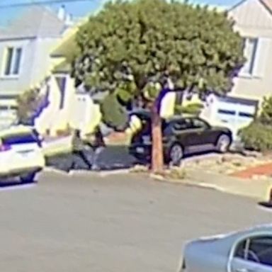 New surveillance video shows an Asian woman in her 50s being attacked and robbed at gunpoint in San Francisco last year.