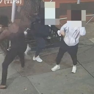 New York City police are searching for the suspect caught on video attacking an Asian woman with a hammer on a Manhattan street.