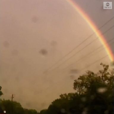 Lightning struck next to a double rainbow as thunderstorms moved through Bastrop County, Texas.