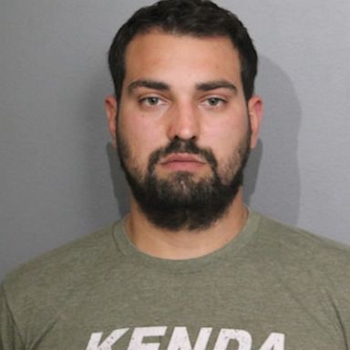  An Iowa man has been arrested after he allegedly left a rifle and ammunition in his Chicago hotel room overlooking Fourth of July activities.