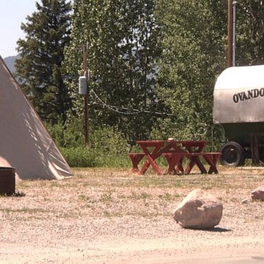 Authorities are searching for a grizzly bear that attacked and killed a bicyclist who was camping in a small western Montana town early Tuesday.