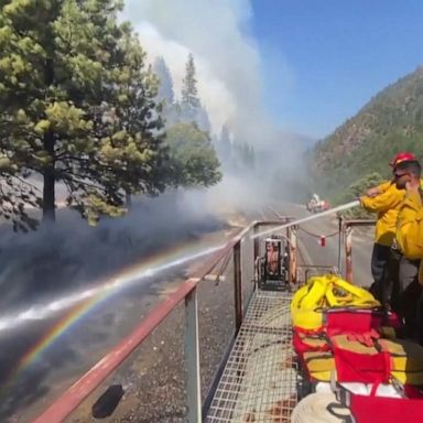 VIDEO: Firefighters battle wildfire from roof of moving train