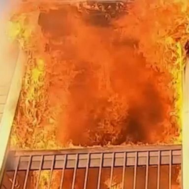 Body camera footage shows firefighters rushing into a burning apartment building where multiple people were allegedly trapped. No serious injuries were reported.