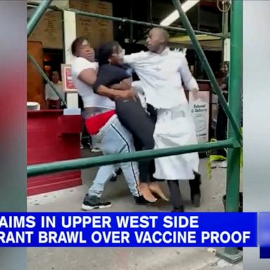 The attorneys for the three women who allegedly injured a New York hostess claim the hostess claimed their vaccination cards were fake, spoke condescendingly and used racist slurs against them.