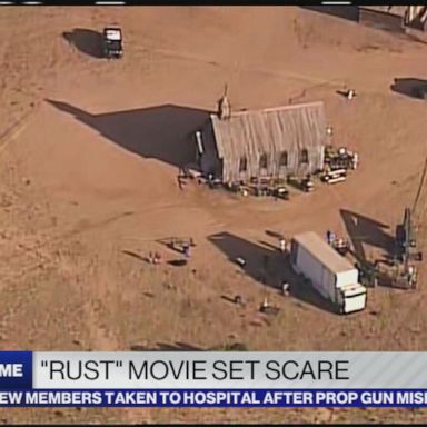 Two crew members on the set of "Rust" were hospitalized Thursday after a prop gun with blanks misfired, according to one of the film's producers.