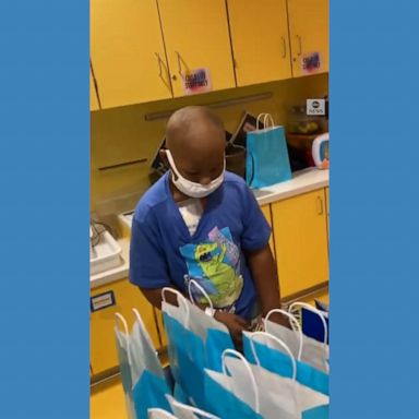 A 7-year-old boy undergoing chemotherapy due to bone cancer prepares gift bags for the sick children at his hospital in Pittsburgh.