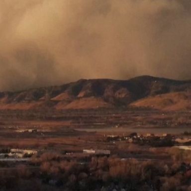 A drone shows a massive dust storm sweeping across mountains in Niwot, Colorado.