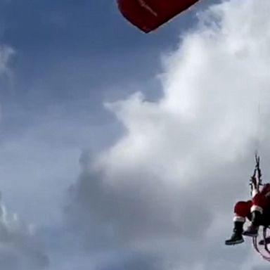 Santa traded in his sleigh for a powered parachute, which he used to glide through the air over Jacksonville Beach, Florida.