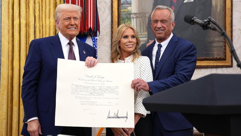 PHOTO: President Donald Trump, Robert F. Kennedy Jr., and Kennedy's wife Cheryl Hines pose before Kennedy was sworn in as Secretary of Health and Human Services in the Oval Office at the White House, Feb. 13, 2025 in Washington.